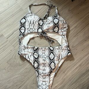 One piece white snack skin with tie back